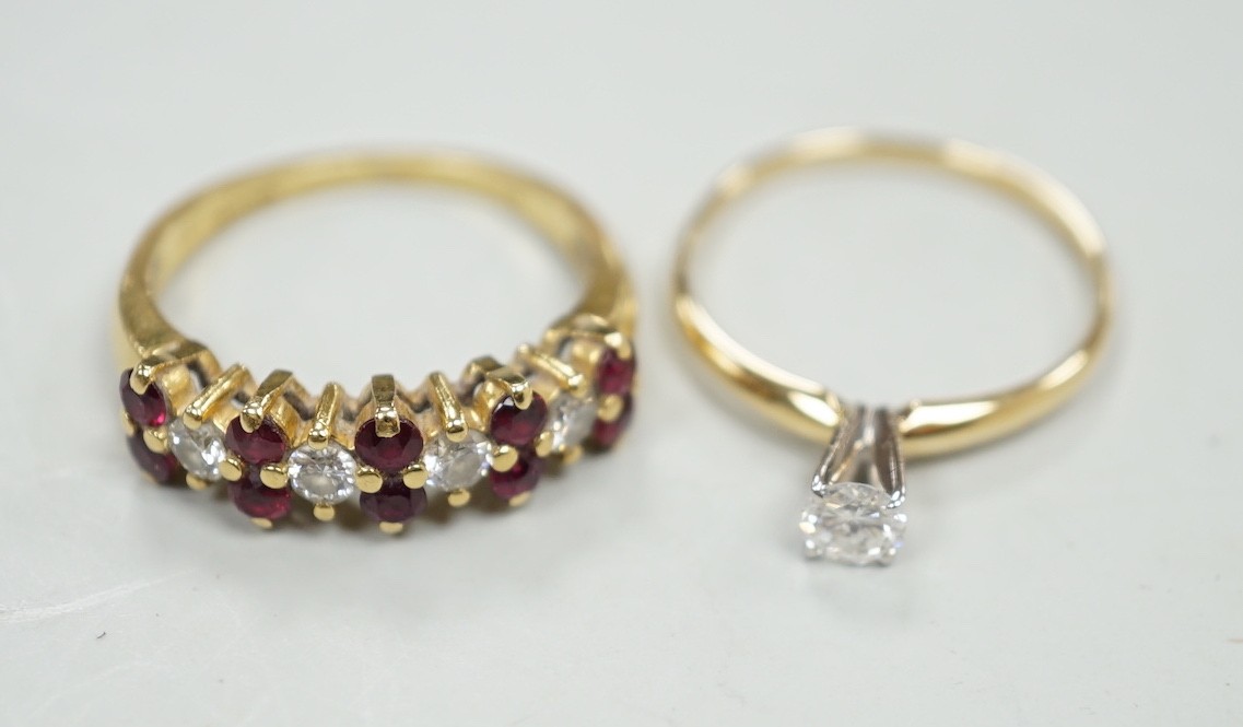 A modern 18ct gold, ruby and diamond cluster set half hoop ring, size L, gross weight 3.4 grams and a 14k and solitaire diamond set ring, size L, gross weight 1.1 grams.
